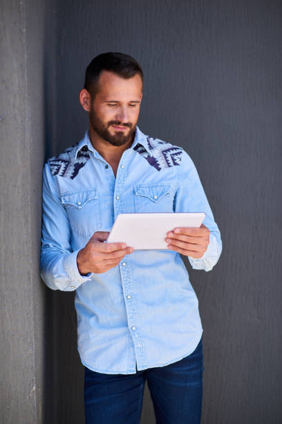 istock Modern businessman in casual clothes with digital tablet 1138528720