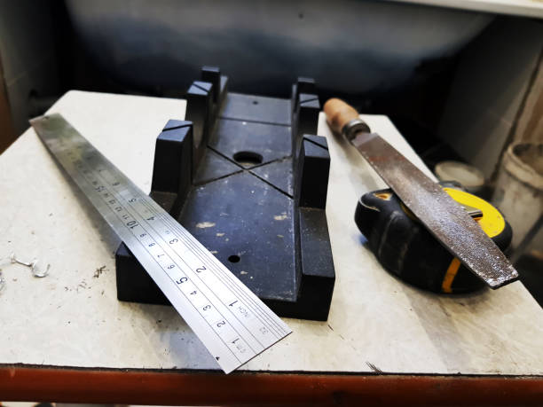 istock Repair - building with tools, tape measure, miter box, file, hacksaw, ruler 1138529680