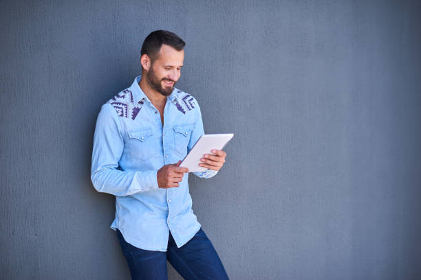 istock Modern businessman in casual clothes with digital tablet 1138529823