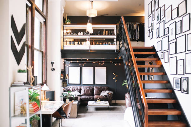 Cozy loft apartment interior in Downtown Los Angeles Interior of a large and bright loft apartment in Downtown Los Angeles, California. loft stairs stock pictures, royalty-free photos & images