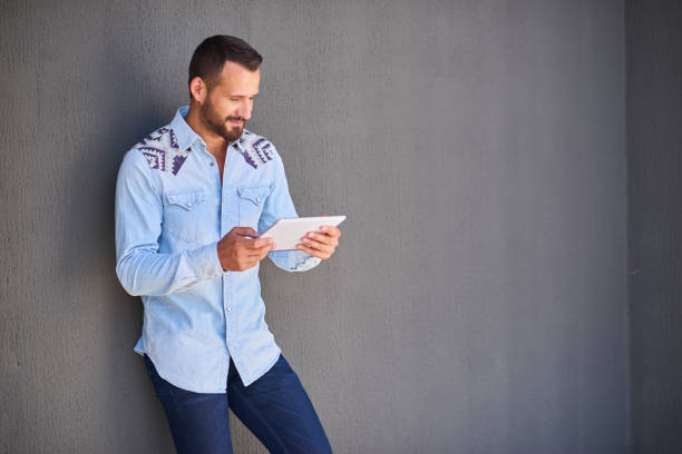 istock Modern businessman in casual clothes with digital tablet 1138531072