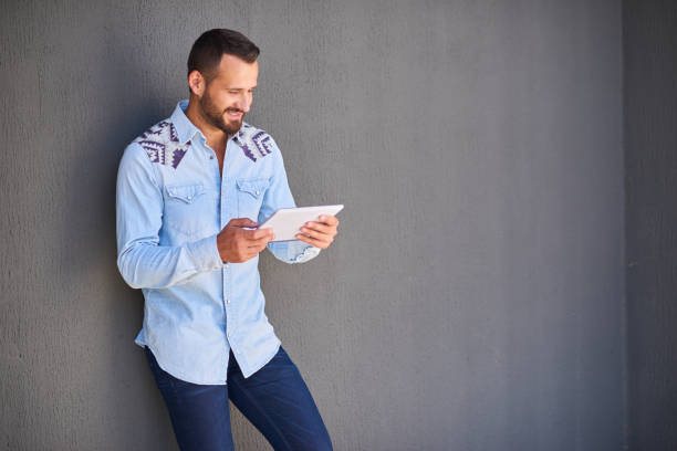 istock Modern businessman in casual clothes with digital tablet 1138531136