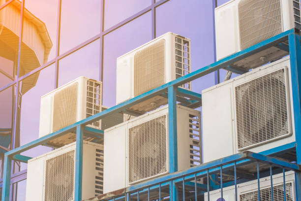 istock Wall of a large office building with blue windows and air conditioning 1138532299