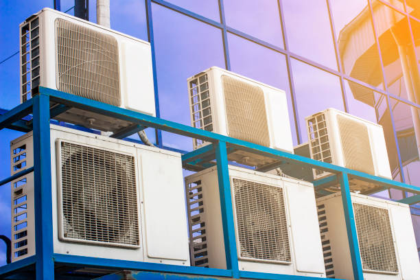 istock Wall of a large office building with blue windows and air conditioning 1138532305