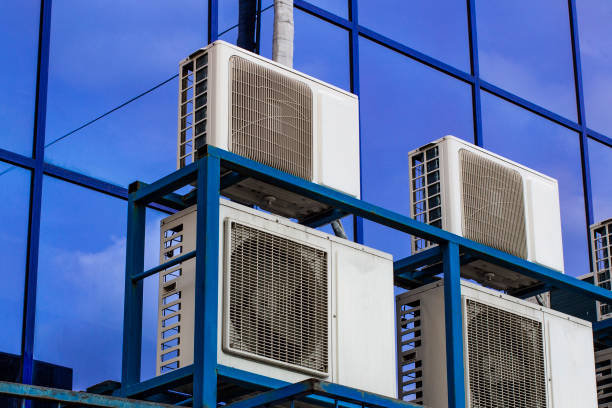 istock Wall of a large office building with blue windows and air conditioning 1138532315