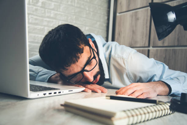 istock sleeping business man in office desk 1138532394
