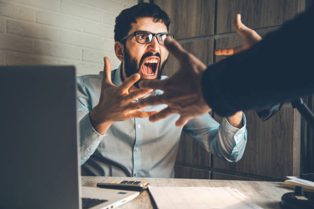 istock angry worker with boss in office desk 1138532411