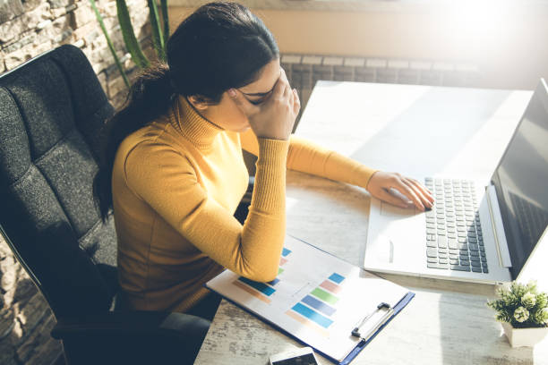 istock sad woman  in office 1138532438