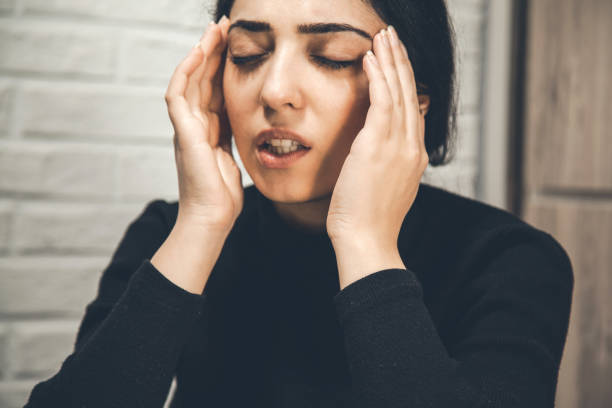 istock young sad woman hand in head 1138532447