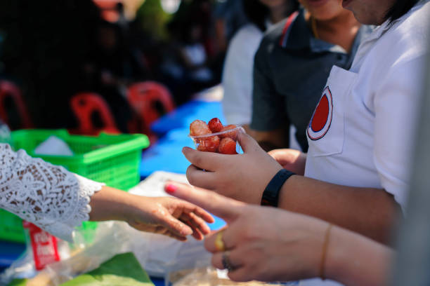 istock Concept of poverty: giving food to beggars with kindness 1138534834