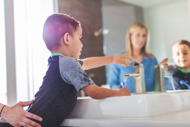 istock Mother and Boys Active At Home Experiencing Quality Life Practicing Good Hygiene 1138537188