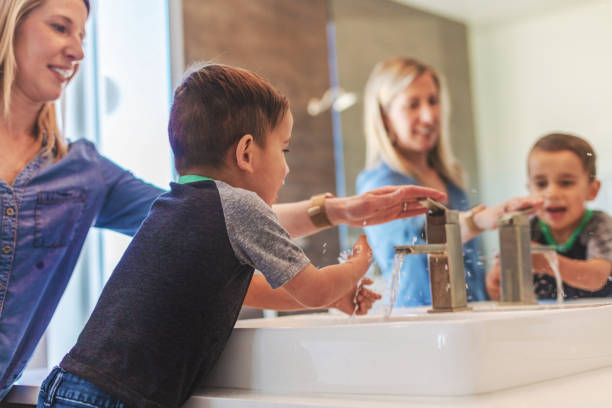 istock Mother and Boys Active At Home Experiencing Quality Life Practicing Good Hygiene 1138537370