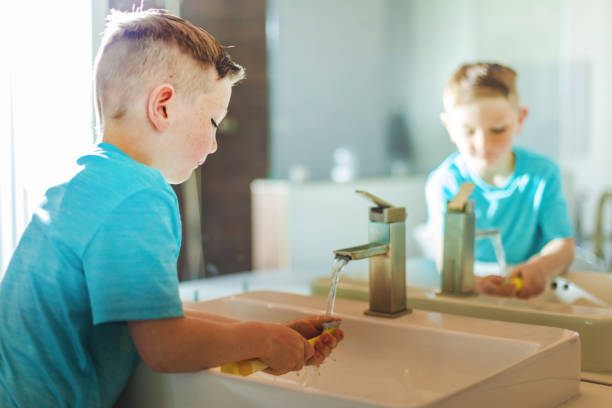 istock Boy Brushing Teeth Active At Home Experiencing Quality Life Practicing Good Hygiene 1138537453