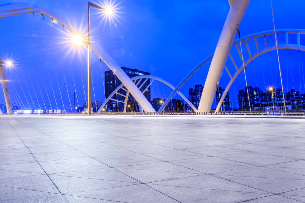 istock Empty square floor and bridge construction in shanghai at night 1138538222