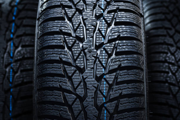 istock Winter tyres on black background with contrasty lighting 1138540317