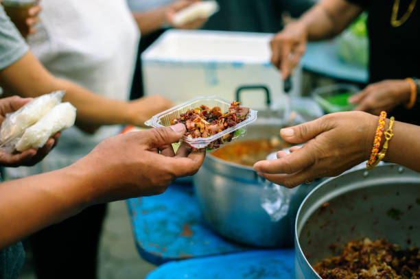 istock Food donation to help people in hunger relief : Sharing concept 1138540703