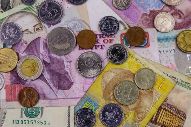 istock Background of banknotes and coins from different countries 1138544752