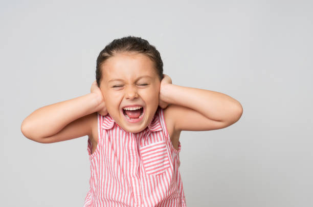 istock Little girl covering ears 1138545897
