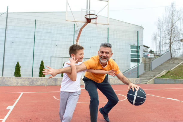 istock Father and son playing basketball 1138545960
