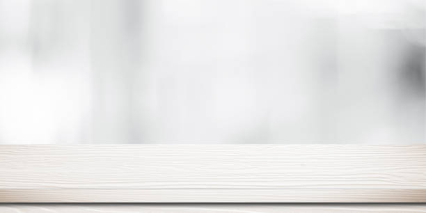 istock Empty white wooden table over blurred store with bokeh background banner, product display montage 1138549956