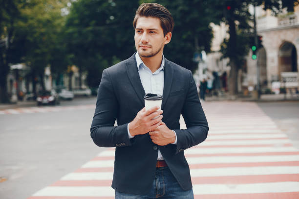 istock Handsome businesman in a summer city 1138550754