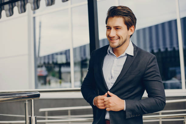 istock Handsome businesman in a summer city 1138551038