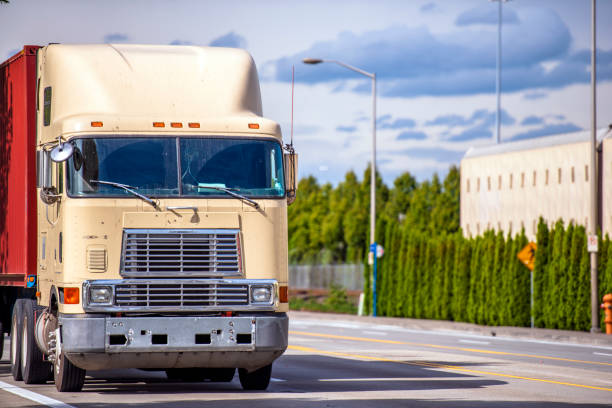 istock Old over engine cab big rig semi truck transporting container on the street road 1138551139