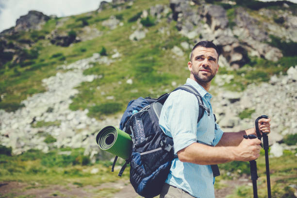istock Tourist man hiking in the mountain 1138553849