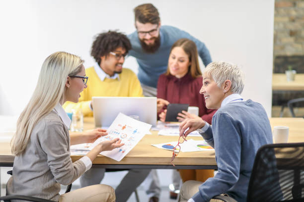 istock Multi-generation and ethnic group of colleagues at meeting 1138555075