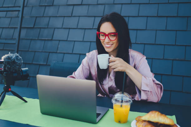 istock Young woman vlogging 1138555267