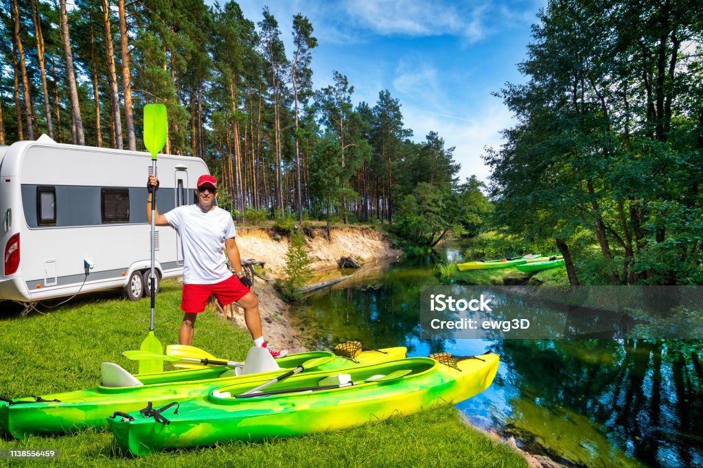 Summer holiday with a canoe in Poland Summer vacation with a camper by the river Wda, Kashubia, Poland Kayak Stock Photo