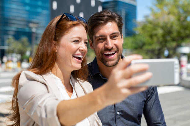 istock Happy couple clicking selfie 1138560073
