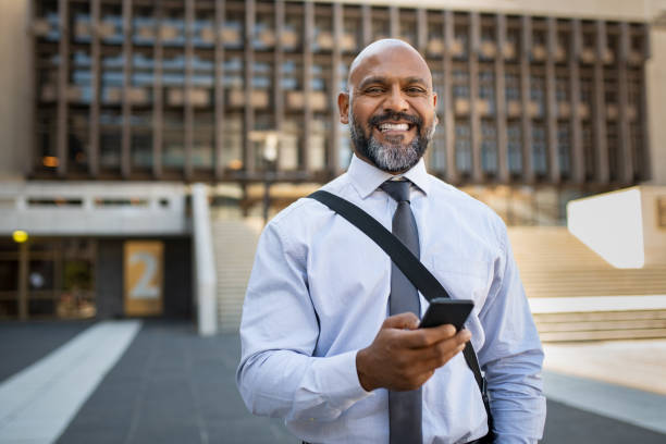 istock Happy mature businessman using phone 1138560408