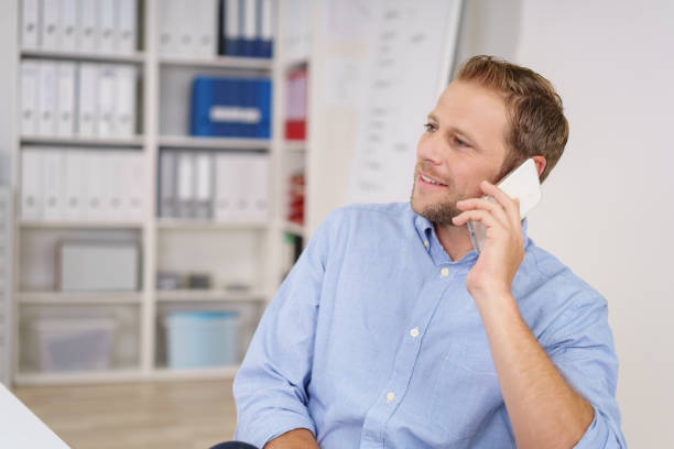 istock Businessman talking on a mobile in the office 1138560788