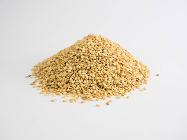 istock Mountain of sesame seeds on white background.  Dry seeds 1138560842