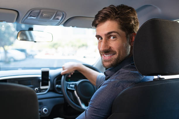 istock Man enjoying driving car 1138561231