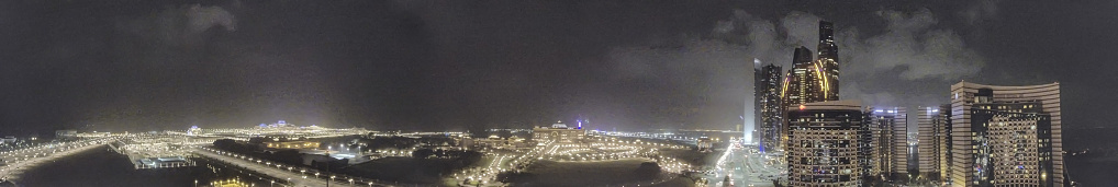 Abu Dhabi night aerial panorama from Corniche Road.