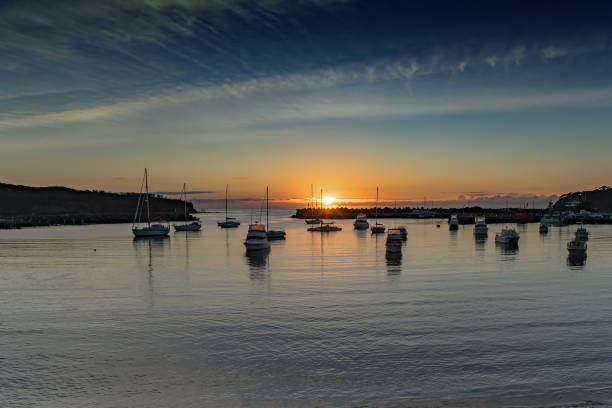 istock Sunrise and boats in the harbour 1138564340