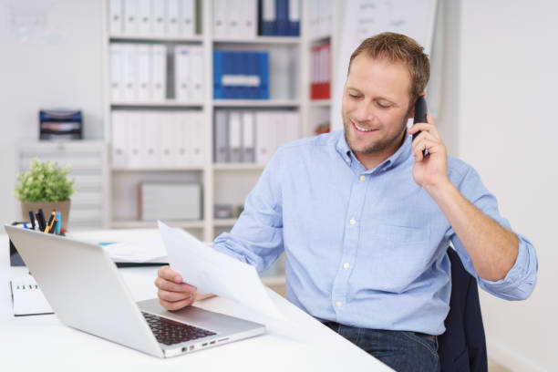istock Happy businessman chatting on the phone 1138564357