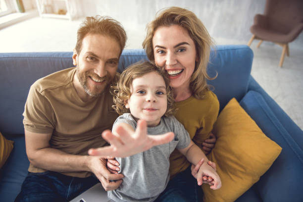 istock Joyful couple is spending time with kid in domestic atmosphere 1138568111