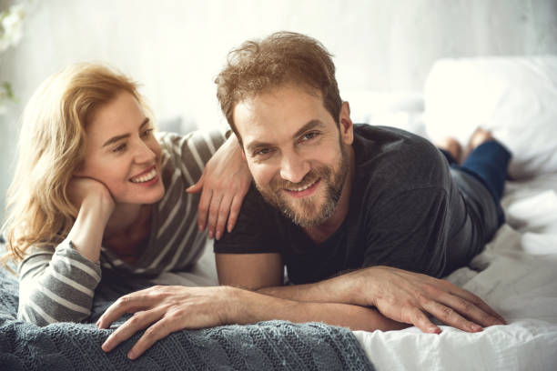 istock Smiling attractive lady is relaxing with boyfriend indoors 1138568148