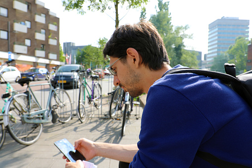 Man Using Mobile Phone In City