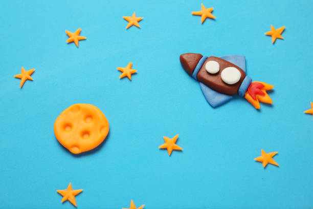 istock Rocket in space, star, and moon. Plasticine art, cartoon 1138569748