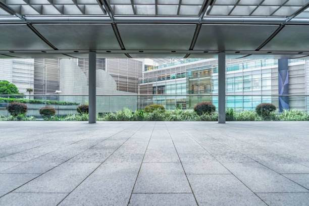istock empty pedestrian walkway/parking lot with roofed structure between buildings 1138573241