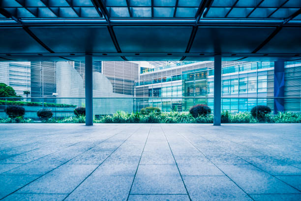 istock empty pedestrian walkway/parking lot with roofed structure between buildings 1138573823