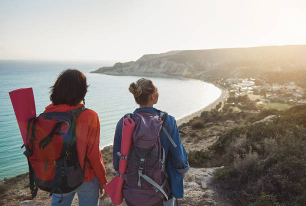 istock Women with backpacks enjoying landscape 1138573897