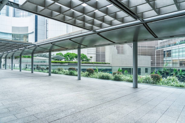istock empty pedestrian walkway/parking lot with roofed structure between buildings 1138574131
