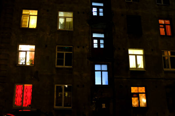 istock residential building with windows of different colors. 1138575684