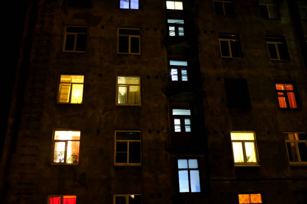 istock residential building with windows of different colors. 1138575685