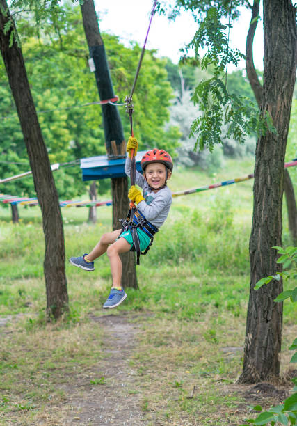 istock Boy at climbing activity in high wire forest park. Table Mountain Cableway kids special on again. 1138576033
